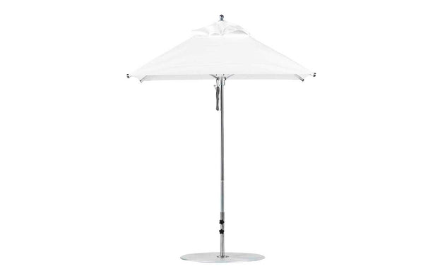 The Ledge Lounger Premier Aluminum Umbrella features a 6.5 square canopy in marine-grade fabric, a sleek silver pole, and a round base. This wind-resistant umbrella provides excellent shade against a plain white background.
