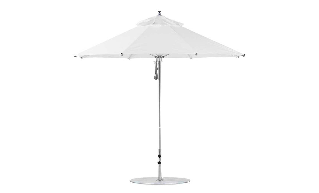 The Ledge Lounger Premier Aluminum Umbrella - 7.5 Octagon Pulley boasts a white finish, round base, sleek metal pole, marine-grade fabrics, and wind vent. Its wind-resistant triangular fabric panels make it ideal for any outdoor setting.