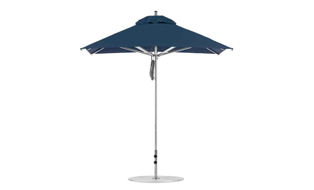 The Ledge Lounger Premier Aluminum Umbrella features a 7.5 square canopy and a sleek metal pole, secured with a strap. Made from marine-grade fabrics, this wind-resistant umbrella offers classic sun protection for outdoor areas.