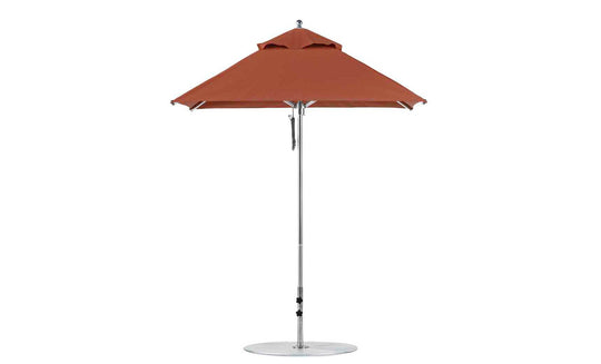 The Premier Aluminum Umbrella by Ledge Lounger features a durable frame and round base, crafted from marine-grade fabric for wind-resistance and shade. This red 6.5 square patio umbrella has a small top vent and stands isolated against a white background.