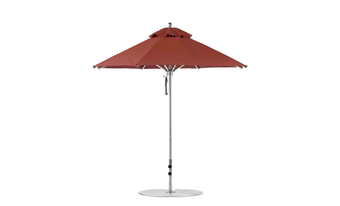 The Ledge Lounger Premier Aluminum Umbrella - 7.5 Octagon Pulley features a dual canopy of marine-grade fabrics, perfect for outdoor in-pool and on-deck use. Its sleek silver pole stands on a round base, with a top vent for wind resistance.