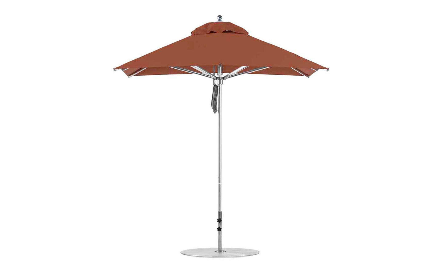 Against a plain white background, the Ledge Lounger Premier Aluminum Umbrella - 7.5 Square Pulley in rust-orange stands upright, crafted from marine-grade fabrics with a silver pole and round base, highlighting its wind-resistant design.