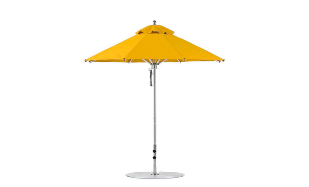 The Ledge Lounger Premier Aluminum Umbrella - 7.5 Octagon Pulley, in bright yellow, features a metal pole and circular base designed for outdoor use. It stands against a plain white background with marine-grade fabric, a classic wide-dome shape, and a peak vent for wind resistance.