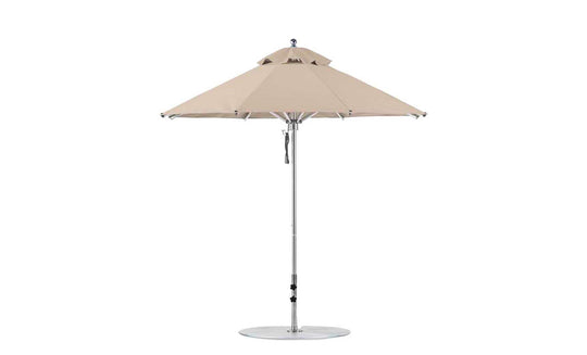Discover the Ledge Lounger Premier Aluminum Umbrella - 7.5 Octagon Pulley, with a beige canopy and metal pole. It features marine-grade fabrics, a round base, and a vented top for air circulation, creating a wind-resistant design perfect for enhancing your outdoor oasis.