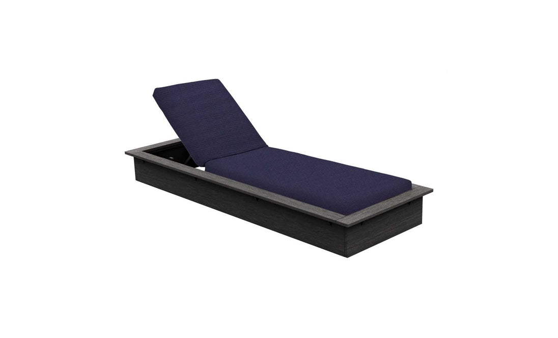 The Echo Chaise by Ledge Lounger features a dark gray frame and navy blue cushion, ideal for outdoor spaces. Its adjustable backrest offers comfortable reclining. The sleek design stands out against a white background.