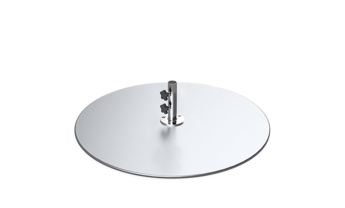 A metallic disc, the Galvanized Steel Stack Umbrella Base by Ledge Lounger, boasts a central pole with two black adjustment knobs, ensuring snug fitting for your umbrella. The reflective base is beautifully set against a plain white background.