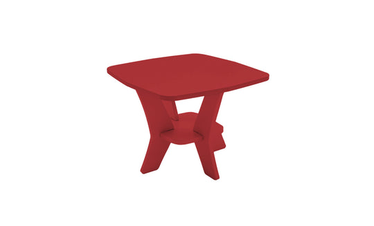 The Mainstay Square Side Table by Ledge Lounger has a red wooden finish, an angular base with intersecting legs, and a small shelf. Ideal for outdoor patios, its showcased on a plain white background.
