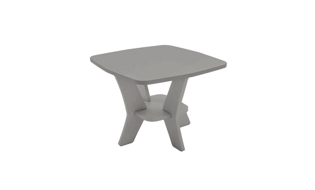 The Mainstay Square Side Table by Ledge Lounger is a modern gray wooden piece with unique angled legs and a small lower shelf. Crafted for minimalist and geometric appeal, it enhances any outdoor patio setting, strikingly displayed against a plain white backdrop.