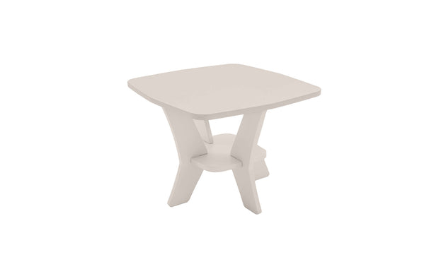 The Mainstay Square Side Table by Ledge Lounger is a modern, minimalist piece in light beige, featuring slightly curved edges and a distinctive leg design where two legs curve inward to meet at a central circular shelf. Note: This item is on final sale.