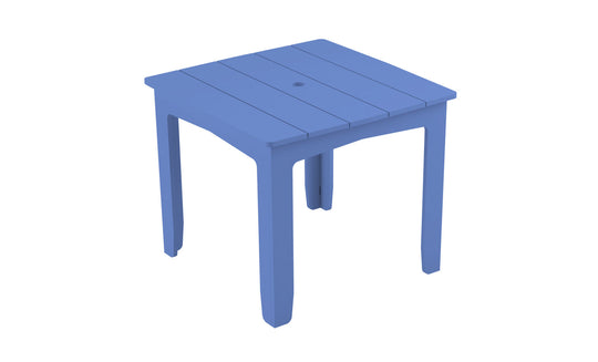 The Mainstay Square Dining Table by Ledge Lounger is a blue plastic table with a slatted top and four sturdy legs, ideal for outdoor dining. It includes a central umbrella sleeve and is showcased on a white background to emphasize its practical design.