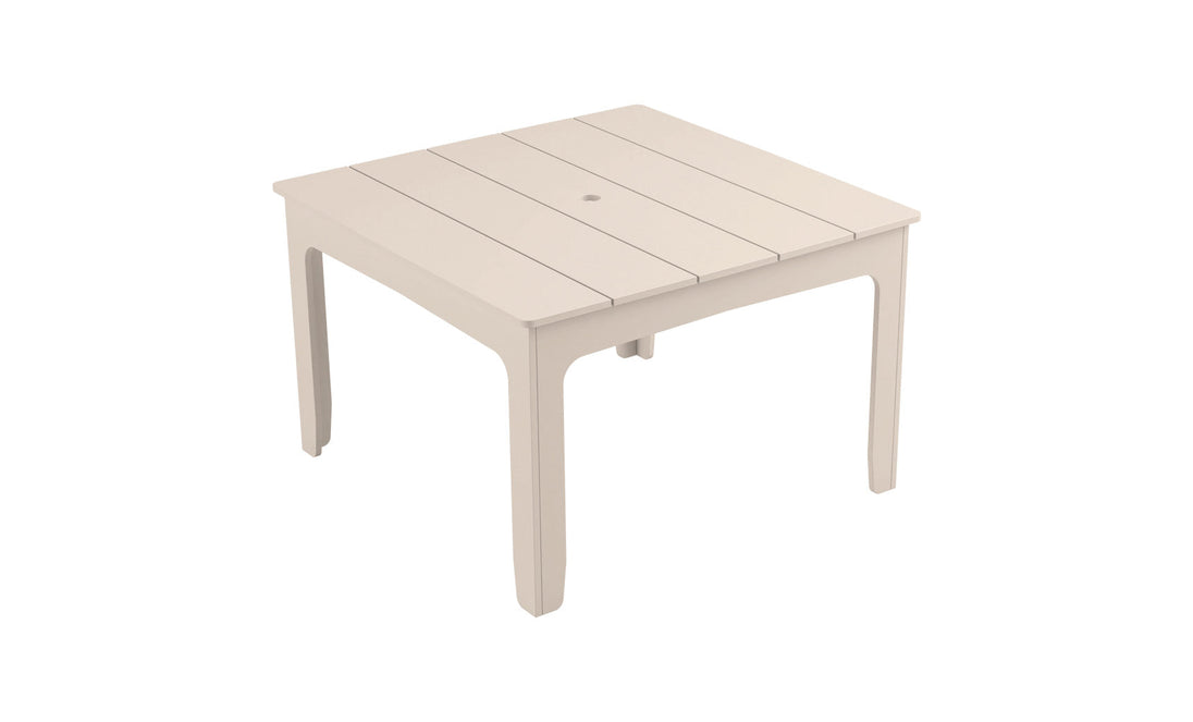 The Mainstay Square Dining Table by Ledge Lounger is beige with a slatted top and built-in umbrella sleeve. Its simple, straight legs enhance the minimalist design, making it ideal for outdoor dining.