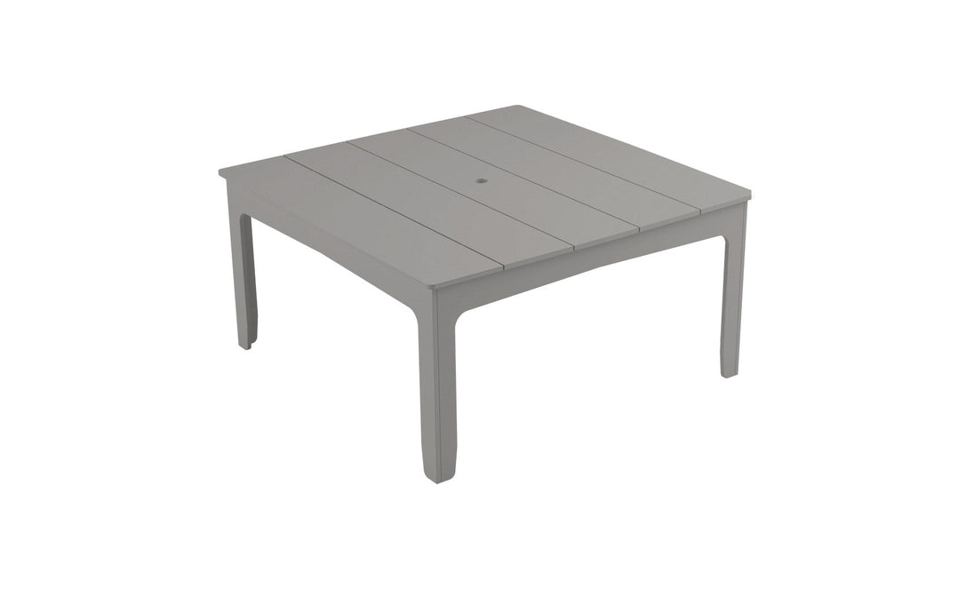 The Mainstay Square Dining Table by Ledge Lounger features a gray plastic slatted top with a built-in umbrella sleeve and straight legs, offering a simple yet functional design ideal for outdoor dining.