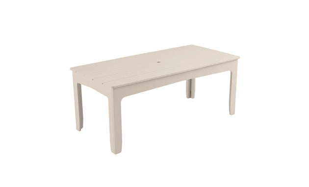 The Mainstay Rectangular Dining Table by Ledge Lounger features a slatted top design, umbrella sleeve, and four straight legs. Its minimalist style suits both outdoor dining and casual indoor settings.
