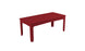 The Ledge Lounger Mainstay Rectangular Dining Table is a red outdoor dining table with four straight legs and a smooth surface, featuring an umbrella sleeve, set against a plain white background.