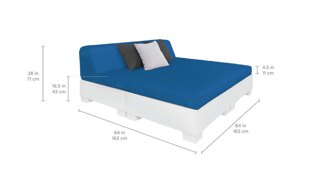 The Affinity Square Sunbed with Backrest Cushion by Ledge Lounger features a white base, blue mattress, and three pillows—blue, gray, and white. It’s ideal for outdoor spaces or poolside relaxing at 28 in (71 cm) high and 64 in (163 cm) wide/deep, with a 4.5 in (11 cm) thick mattress.