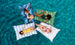 Four women are lounging on Laze Pillow floats by Ledge Lounger in a clear blue pool. Theyre wearing swimsuits with eyes closed, their colorful floats arranged in a cross shape, enjoying unparalleled outdoor comfort as they drift peacefully on the calm, vibrant water.