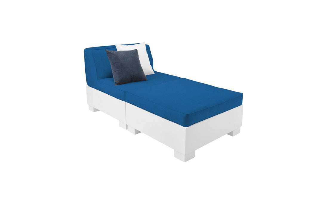 The Ledge Lounger Affinity 2 Piece Sun Chair showcases a contemporary design with a blue cushion and two pillows—one dark blue and one white. It features a simple white base made from UV20 rated resin, making it ideal outdoor furniture against a plain white background.