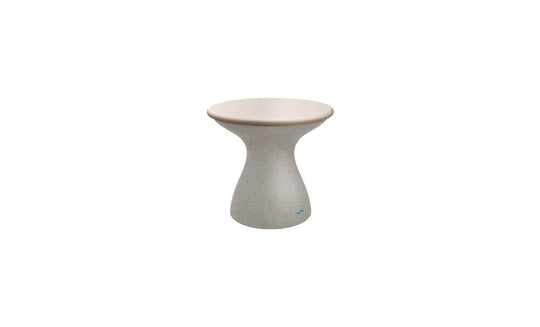 The Autograph Standard Side Table by Ledge Lounger features a tall, hourglass design with a smooth, beige top and textured gray base, making it the perfect elegant addition for poolside decor.