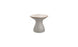 The Autograph Standard Side Table by Ledge Lounger features a tall, hourglass design with a smooth, beige top and textured gray base, making it the perfect elegant addition for poolside decor.