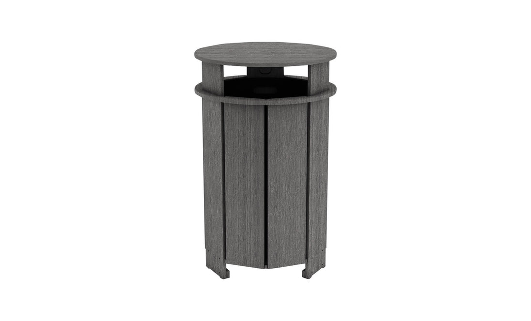 The Mainstay Trash Bin by Ledge Lounger is a tall, cylindrical wooden trash can with vertical planks. It features a dark gray finish and an open top for easy disposal.