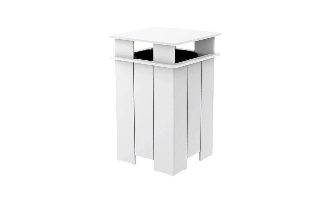 The Mainstay Trash Bin by Ledge Lounger is a modern, sleek white pedestal stand with a square top and open design, made from UV stable materials. Featuring vertical slats and a partially visible black circular object inside, its minimalist look suits contemporary indoor or patio decor.