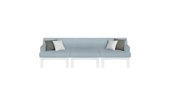 The Mainstay Sectional 3 Piece Sofa by Ledge Lounger is a long, light blue minimalist outdoor sectional set. It includes three sections and comes with two white and two gray throw pillows, styled for comfort against a plain white background.