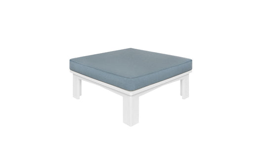 The Mainstay Sectional Ottoman by Ledge Lounger boasts a blue cushion on a minimalistic white frame and legs, providing endless configurations to enhance your living space.