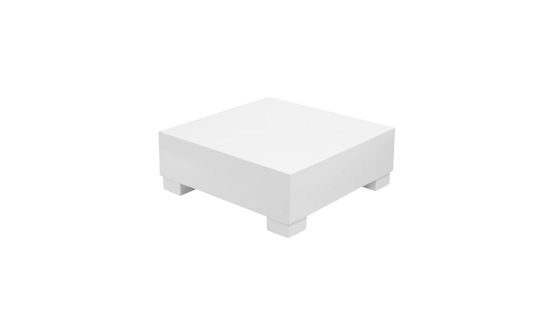 Discover the Signature Coffee Table by Ledge Lounger: a white square pedestal table with short legs, ideal for elevating any space.