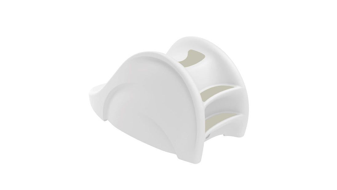The Ledge Lounger Signature Slide is a chic and functional poolside accessory with a modern, white curved design featuring three arched slots for napkins. It enhances any table setting with elegance against a plain white background.