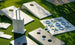 Ledge Lounger Cornhole and other outdoor yard games rest on green grass, featuring portable stackable boards with handles and playful tic-tac-toe sets. Sunlight casts lively shadows over the scene.