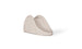 The Signature Slide by Ledge Lounger is a beige, minimalist indoor childrens slide made of plastic with smooth, curved edges. It includes top side handles for safety and stability, resembling a modern pool slide design.