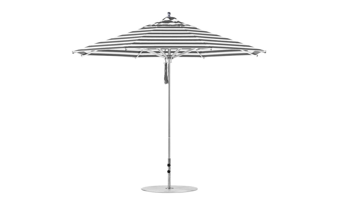 The Ledge Lounger Premier Aluminum Umbrella - 11 Octagon Pulley, with black and white stripes, features a pointed top and slender pole on a round base. Its constructed from marine-grade fabrics for excellent wind resistance.