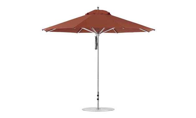 The Ledge Lounger Premier Aluminum Umbrella - 11 Octagon Pulley boasts a large red canopy made of durable marine-grade fabrics. Its sturdy base and metal pole provide wind resistance, ensuring its stable in any weather.