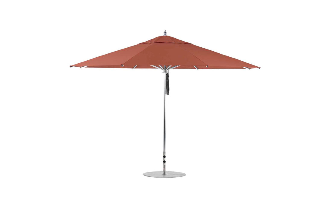 The Ledge Lounger Premier Aluminum Umbrella - 13 Octagon Pulley boasts a large, red outdoor canopy with an aluminum pole and base. Expertly crafted for durability and style, its wind-resistant design offers ample shade for any patio setting.