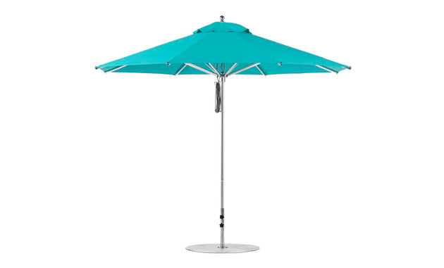 The Ledge Lounger Premier Aluminum Umbrella - 11 Octagon Pulley showcases a turquoise marine-grade fabric canopy on a thin silver pole with a robust round metal base, fully opened against a white background. Its designed to resist wind effectively.