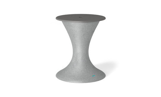 The Ledge Lounger Autograph Umbrella Stand Ice Bin is a chic hourglass-shaped outdoor table with a textured gray finish, tapering wide at the base and top. The slightly darker gray flat top has a central detail ideal for an umbrella stand.