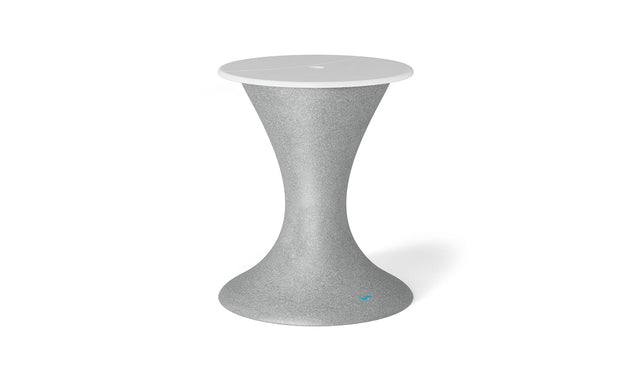 The Autograph Umbrella Stand Ice Bin by Ledge Lounger features a sleek hourglass design with a textured gray surface and smooth white round top, ideal as an indoor accent or innovative outdoor table, highlighting modern aesthetics.