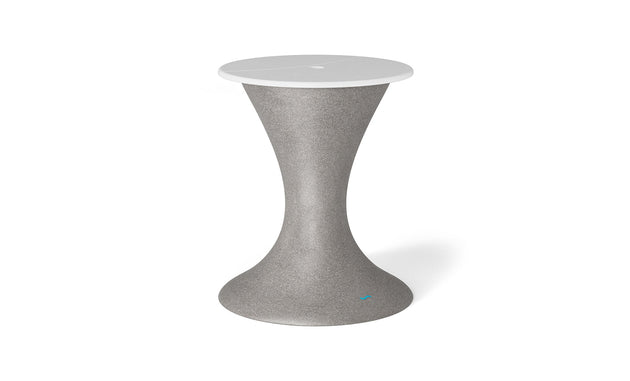 The Autograph Umbrella Stand Ice Bin by Ledge Lounger is a sleek, hourglass-shaped piece in gray with a white top, perfect as an outdoor table centerpiece. Its minimalist design offers style and functionality, standing out against a plain white backdrop.