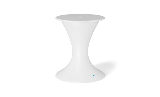 The Autograph Umbrella Stand Ice Bin by Ledge Lounger is a sleek, modern white side table in a flared hourglass shape, ideal for outdoor settings. It has a round top and base with minimalist elegance and a subtle blue accent on the bottom edge for serenity.