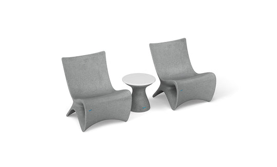 The Classic Luxury In-Pool Chair Duo by Ledge Lounger features two modern gray chairs with curved backs, positioned on either side of a matching gray side table with a white top, all showcasing a sleek, minimalist design.