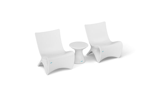 Two Classic Luxury In-Pool Chair Duo pieces by Ledge Lounger, with a small matching side table on a white background, showcase sleek, minimalist design and gentle curves—ideal for contemporary spaces.