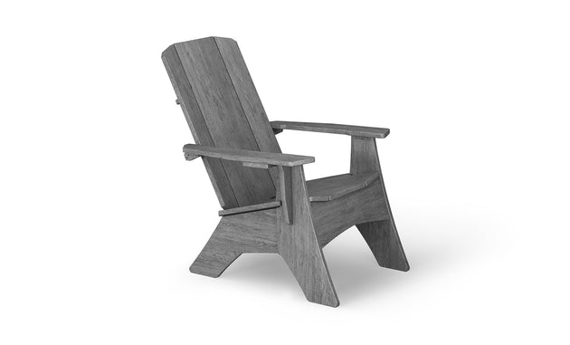 The Mainstay Ultimate Adirondack by Ledge Lounger is a wooden chair ideal for poolside relaxation, featuring a high backrest and wide armrests. Its simple rustic design and slightly reclined seat are perfect for outdoor lounging, beautifully displayed at an angle on a white background.