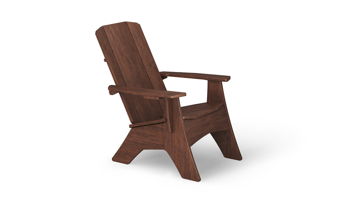 The Mainstay Ultimate Adirondack by Ledge Lounger, ideal for outdoor lounging, boasts a high backrest, wide armrests, and angled legs. Presented on a white background, its rich brown wood grain and robust design are prominently displayed.