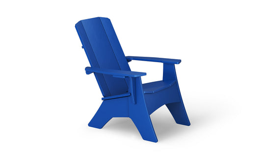 The Mainstay Ultimate Adirondack by Ledge Lounger, a blue outdoor lounge chair, features a high backrest and wide armrests. It is viewed from the side against a plain white background.