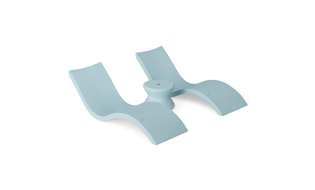 A modern abstract sculpture in light blue, reminiscent of two curved seats like the Signature In-Pool Chaise Loungers from Ledge Lounger, joined by a central circular base with smooth lines, embodies a minimalist design ideal for the Outdoor Oasis In-Pool Furniture Bundle.