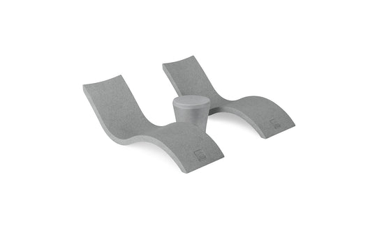 The Ledge Lounger Signature Chaise and Affinity Side Table In-Pool Set features two modern gray wave-shaped loungers with a side table between them, displayed on a white background.
