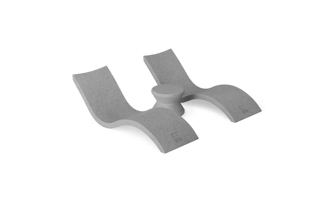 The Ledge Lounger Outdoor Oasis In-Pool Furniture Bundle includes a minimalist, gray L-shaped foam support with two curved sections and a central cylindrical part. Designed for ergonomic comfort and modern aesthetics, its perfect for adding style to your poolside essentials.