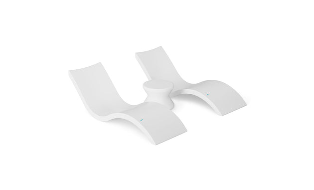 Two sleek, modern white lounge chairs with curved designs and a small round table between them on a plain white background. The Ledge Lounger Outdoor Oasis In-Pool Furniture Bundle offers a minimalist look, ideal for transforming your outdoor space into an escape.