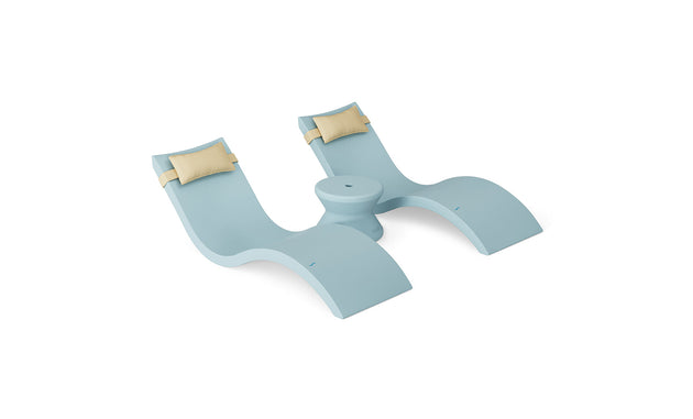 The Ledge Lounger Signature Chaise Headrest Pillow and Side Table In-Pool Set features a light blue double chaise lounge with two beige headrest pillows and a built-in center table, ideal for outdoor or poolside relaxation. Shown on a white background.