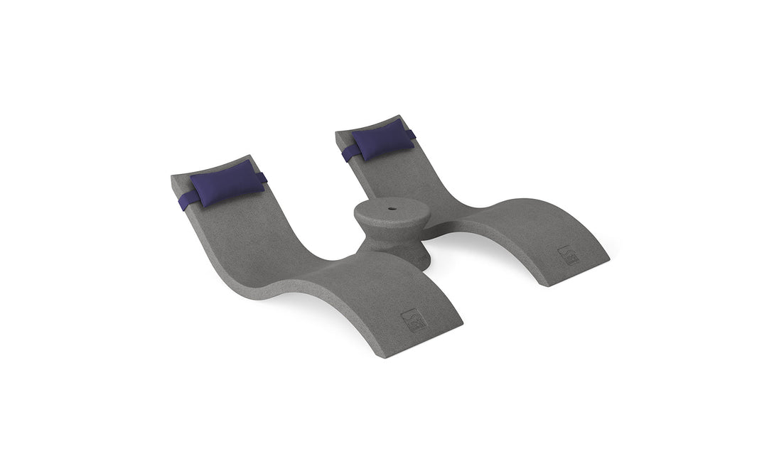 The Ledge Lounger Signature Chaise Headrest Pillow and Side Table In-Pool Set features two reclining gray loungers with dark blue headrests and a central round table—ideal for relaxing in style on your pool ledge.